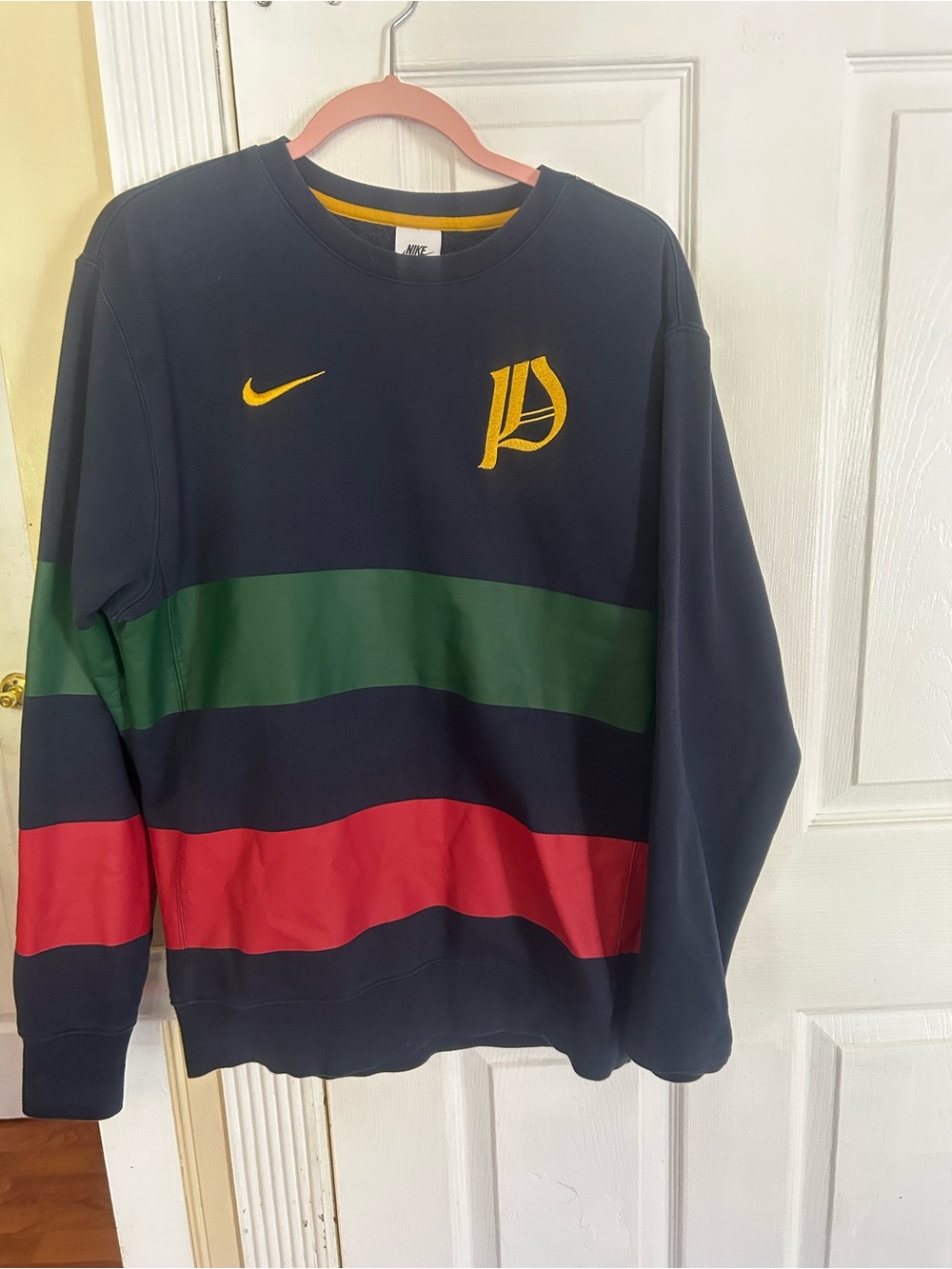 Nike Portugal FIFA Club Crew sweatshirt featuring horizontal green and red strip